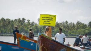 A fisherman during the protest on 27 July , asking who should pay the price? 