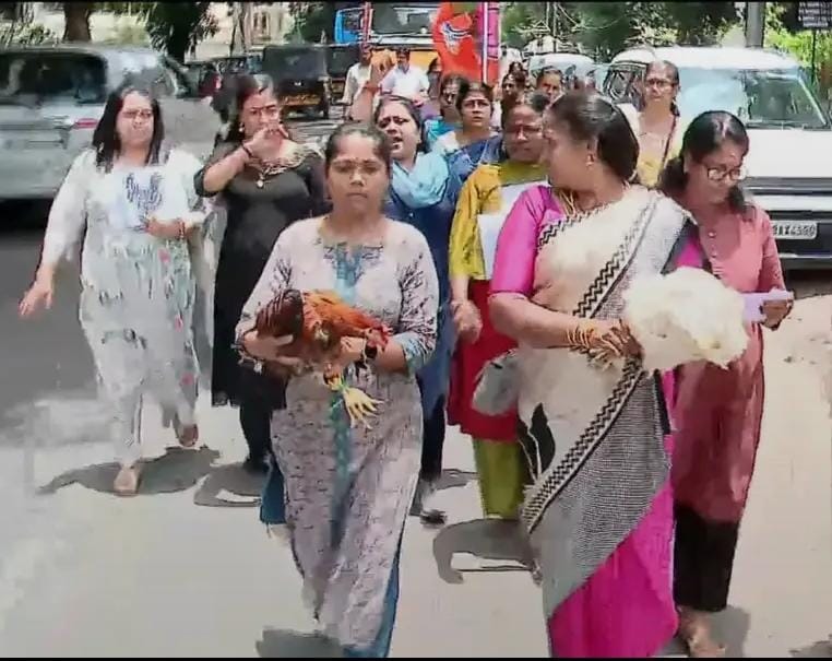 Women taking out a demonstration against Rahul Mamkootathil with roosters.