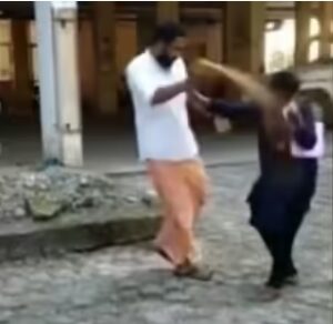 Bindu Ammini being attacked with pepper spray.