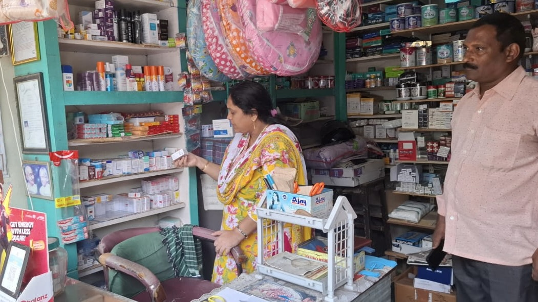 Drug control officials inspect a pharmacy in Anakapalle town, Andhra Pradesh, on Monday. (Supplied)