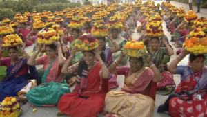 Women gathering with flowers to celebrate Bathukamma