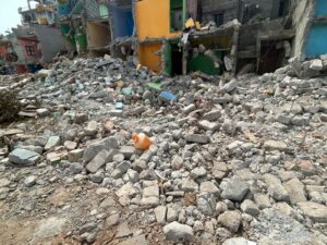 When residents resisted by standing in front of the bulldozers, officials allegedly resorted to a lathi charge.