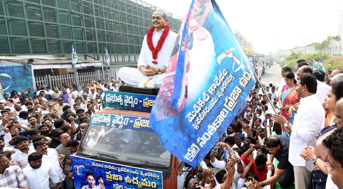 Jagan Mohan Reddy flags off a long convoy of vehicles carrying sealed boxes of petitions