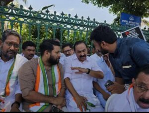 Rahul Mamkootathil (right) with VD Satheesan (centre) and Shafi Parambil