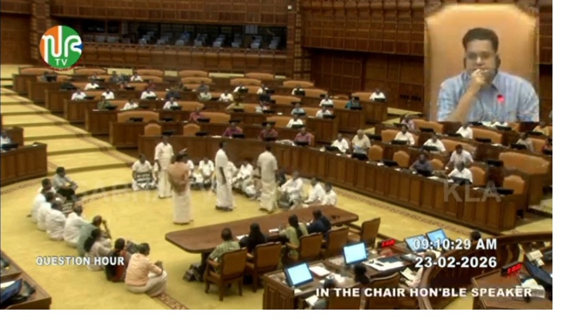 Opposition MLAs sat in the Well, raising slogans demanding Minister Vasavan's resignation. (Niyamasabha TV)