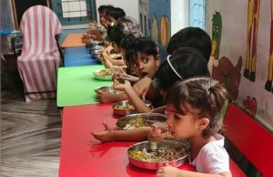 Anganwadi children enjoying their midday meal.
