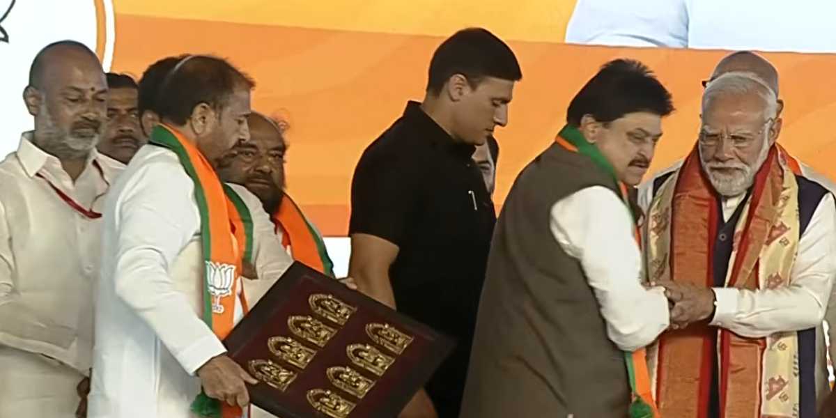 Bandi Sanjay (L) seen sharing a stage with PM Modi in Hyderabad on Sunday.