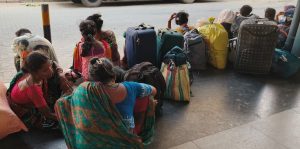 Migrant workers arrive at Aluva railway station.