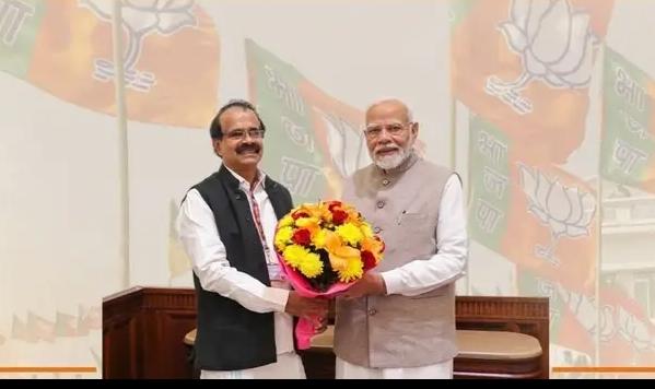 George Kurian with Prime Minister Narendra Modi.