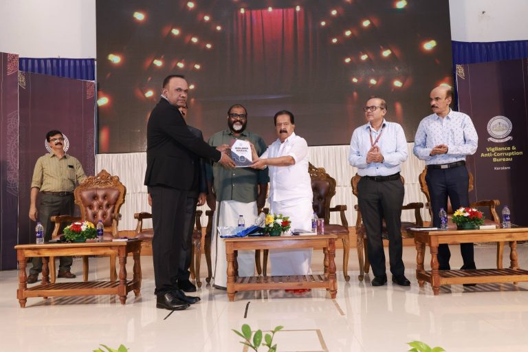 Home Minister Ramesh Chennithala unveiling the revised Vigilance Manual by handing over a copy to VACB Director Manoj Abraham, IPS.