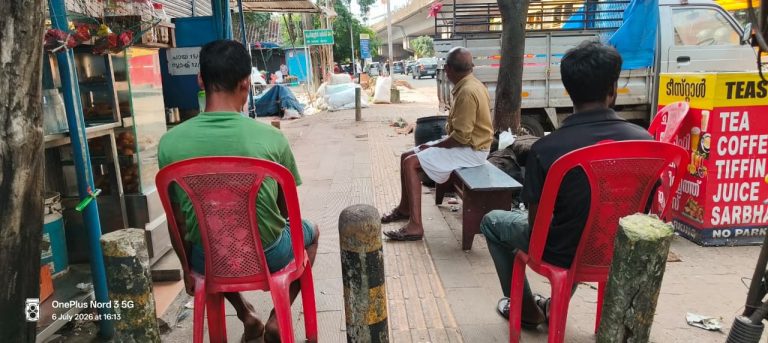 Ernakulam, 6 July: A teashop near Aluva Market has its seating arrangements on the footpath, forcing pedestrians to find alternatives.