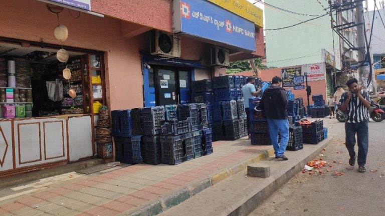 A shopkeeper has conveniently stored his cartons on the footpath, while pedestrians take the road near the Banashankari Metro in Bengaluru.