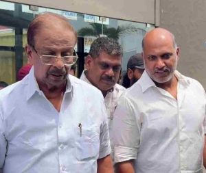 K. Sudhakaran MP with Mattancherry Harris (identified in the white plain shirt).