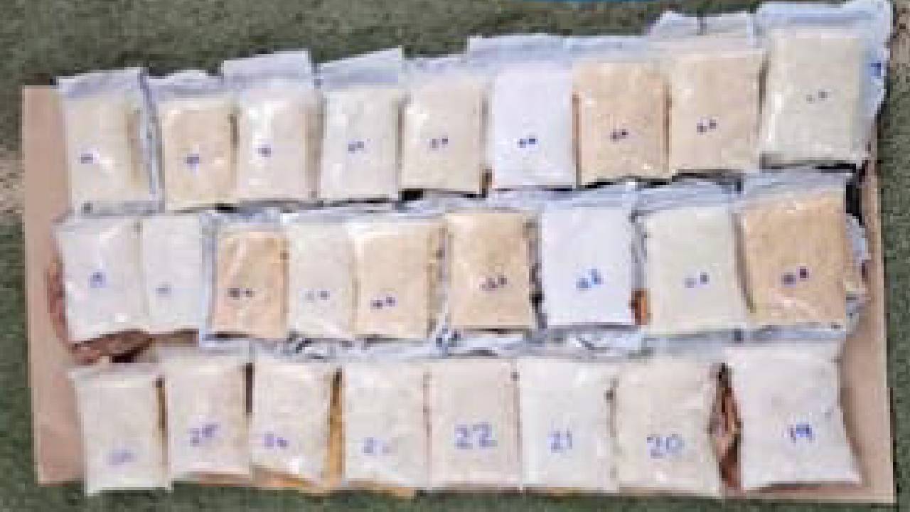 The contraband weighing 12.794 kg was concealed in separate packets in different places in the vehicle.