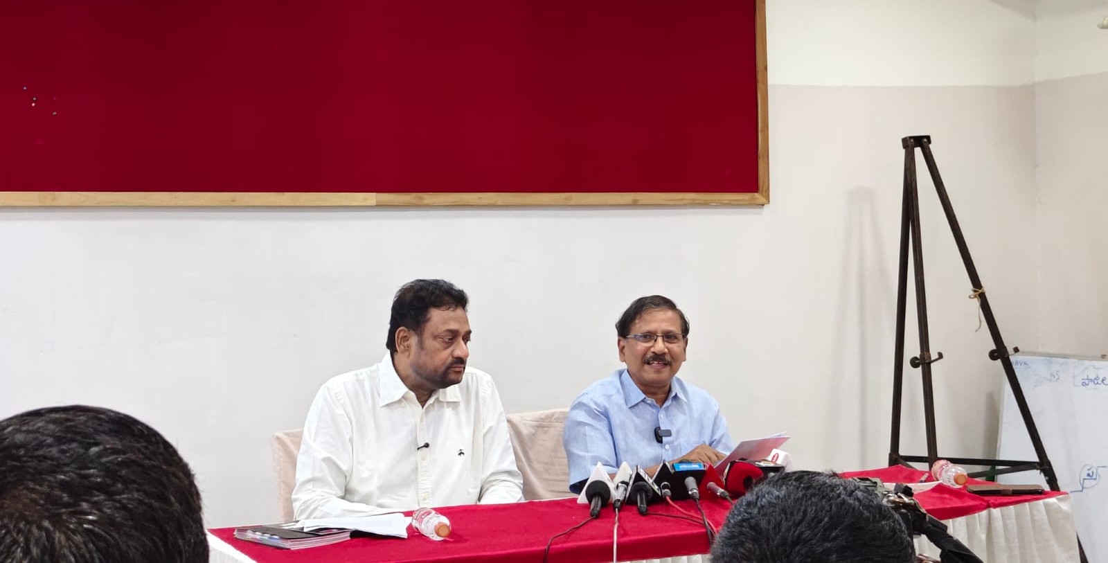 Retired IAS officer Vijay Kumar and Medico Parents' Association President Dr. Venkateswarlu speaking to the media
