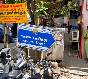 blue Greater Chennai Corporation street sign reading “Vanniyar Street” in Tamil and English