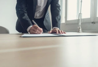 a person signing the documents file for HRD attestation