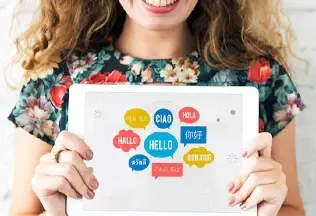 An illustration of translation services with three characters and language-related icons