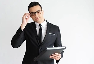 A man holding goggles with black suite