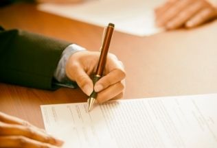 Filling official legal documents with pen