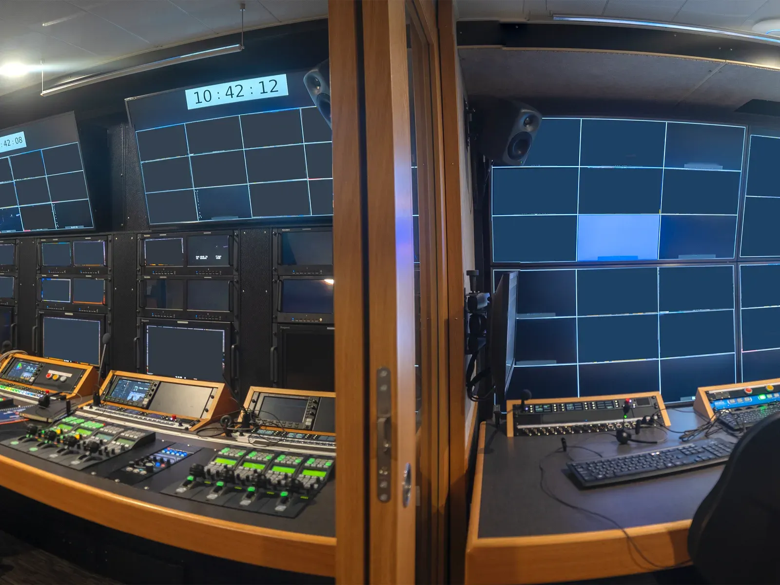 Broadcast control room with a wall of monitors