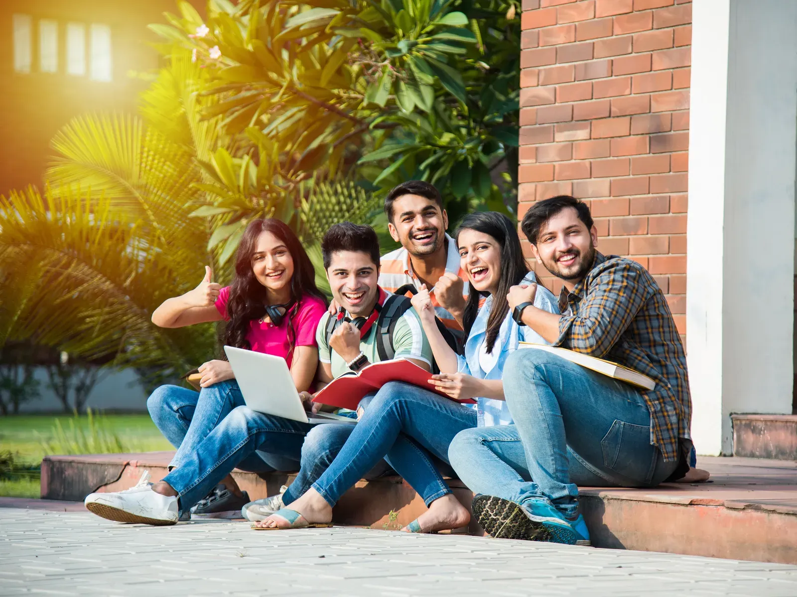 Young Indian college students studying on campus