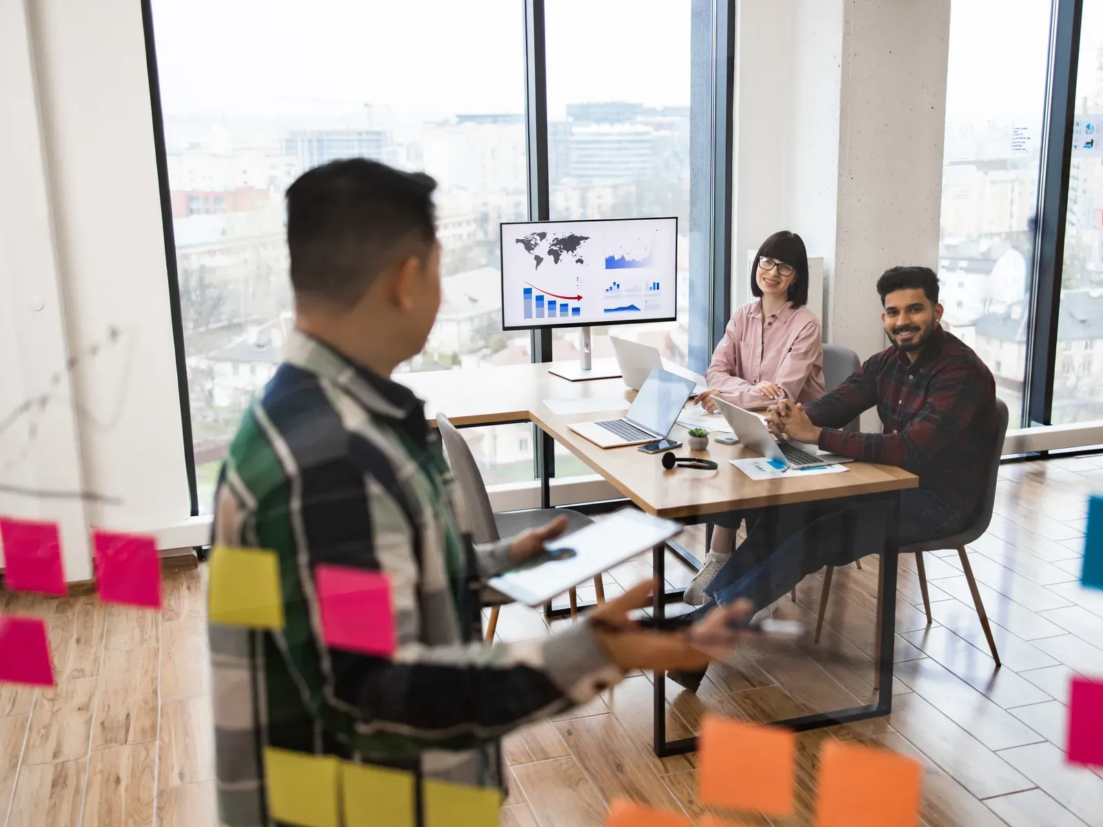 Indian founding team brainstorming with sticky notes