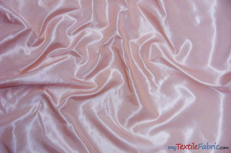 How Can Taffeta Fabric Be Used for Stage Design and Backdrop Installations?