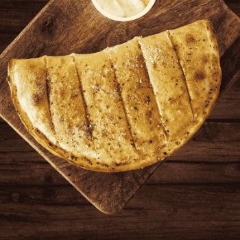 Paneer Tikka Stuffed Garlic Bread-https://s3.ap-south-1.amazonaws.com/prod-media-vyaparify-com/vcards/products/133985/product_1738942621_67a6289db6f87.png Image