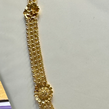 Classic Gold Multi-Layered Mala or Haar with Floral Motif-https://s3.ap-south-1.amazonaws.com/prod-media-vyaparify-com/vcards/products/195683/product_1745413878_6808e6f638864.png Image