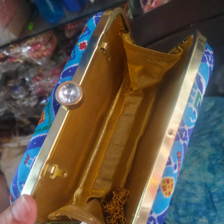 Embroidery Clutch Bags-https://s3.ap-south-1.amazonaws.com/prod-media-vyaparify-com/vcards/products/222871/product_1746874391_681f3017da96a.png Image