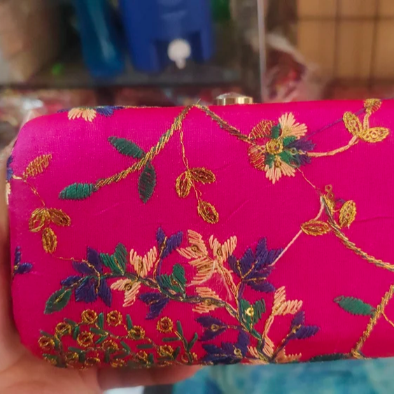 Embroidery Clutch Bags-https://s3.ap-south-1.amazonaws.com/prod-media-vyaparify-com/vcards/products/222874/product_1746874392_681f30184688c.png Image