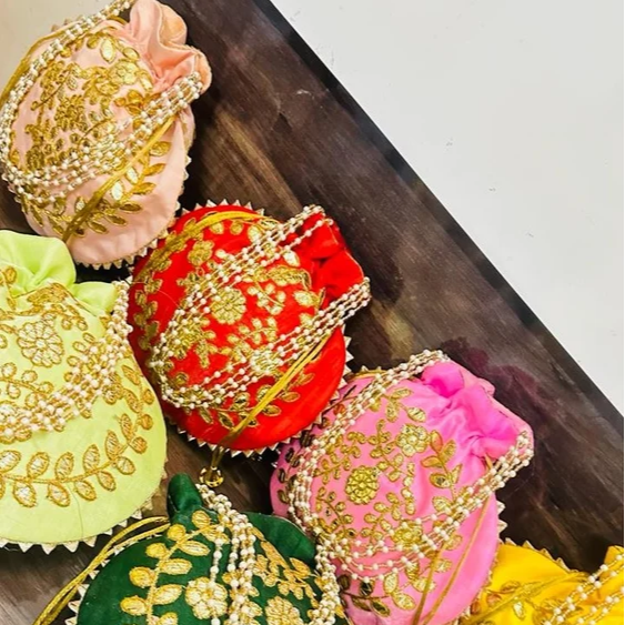 Fancy Potli Bag-https://s3.ap-south-1.amazonaws.com/prod-media-vyaparify-com/vcards/products/222918/product_1746877689_681f3cf9d912e.png Image