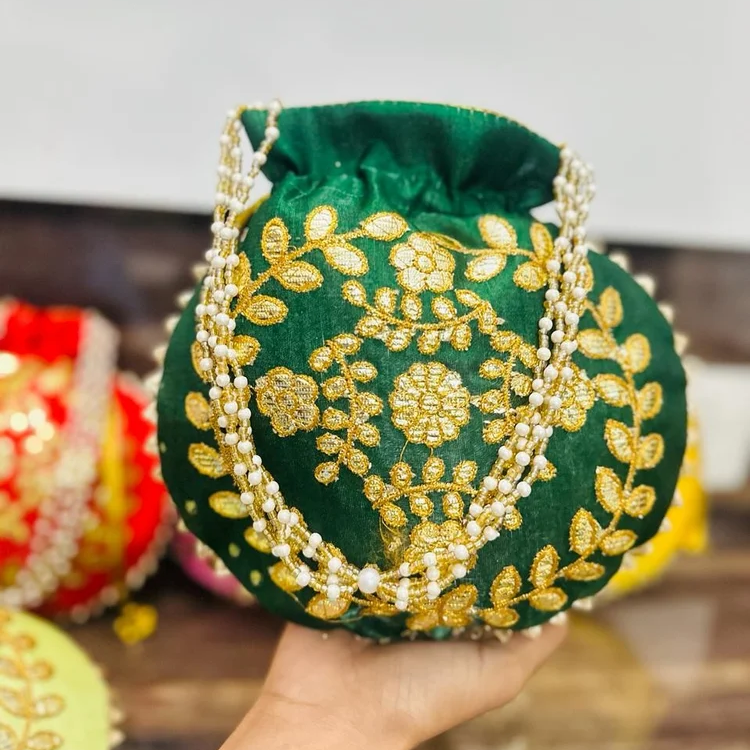 Fancy Potli Bag-https://s3.ap-south-1.amazonaws.com/prod-media-vyaparify-com/vcards/products/222919/product_1746877689_681f3cf9ec31e.png Image