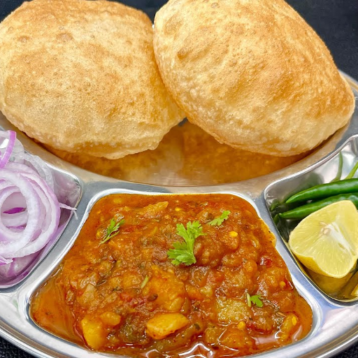 Puri bhaji-https://s3.ap-south-1.amazonaws.com/prod-media-vyaparify-com/vcards/products/415566/product_1763371595_691aea4b5fc5e.png Image