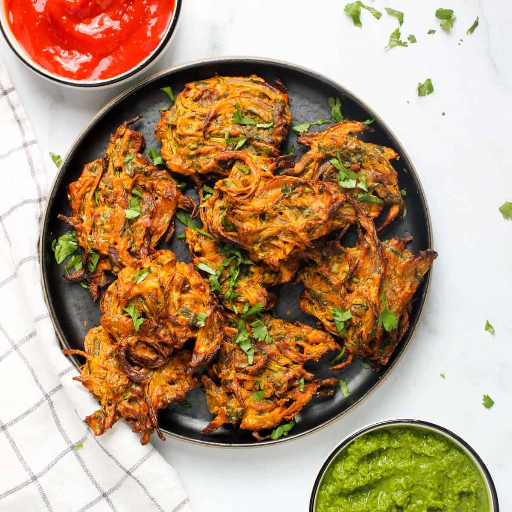 Onion pakoda (snacks)-https://s3.ap-south-1.amazonaws.com/prod-media-vyaparify-com/vcards/products/426143/product_1763988421_692453c5627fa.png Image