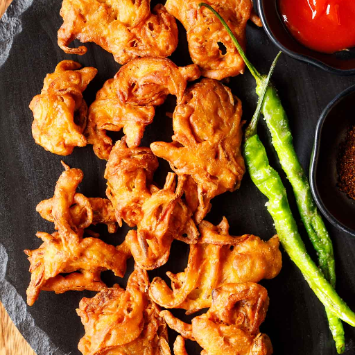 Veg pakoda (snacks)-https://s3.ap-south-1.amazonaws.com/prod-media-vyaparify-com/vcards/products/426403/product_1764049968_69254430c5e09.png Image