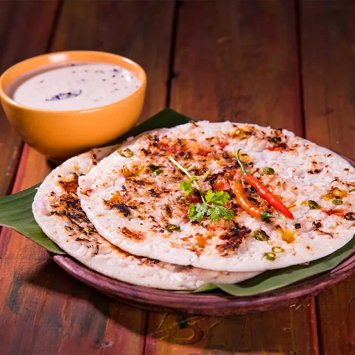 Onion uttapam (south indian food)-https://s3.ap-south-1.amazonaws.com/prod-media-vyaparify-com/vcards/products/428120/product_1764141444_6926a98428817.png Image