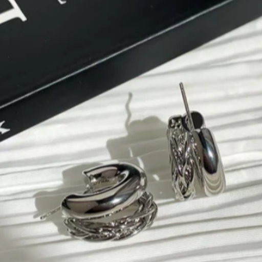 Double layer Twisted metal earring-https://s3.ap-south-1.amazonaws.com/prod-media-vyaparify-com/vcards/products/434070/product_1764597670_692d9fa67521d.png Image