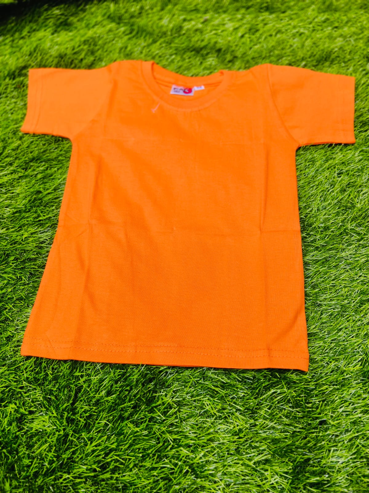Kids' T-Shirt in Mumbai: Bright Orange Playful Comfort-https://s3.ap-south-1.amazonaws.com/prod-media-vyaparify-com/vcards/products/444285/product_1765188051_6936a1d3d6d92.png Image