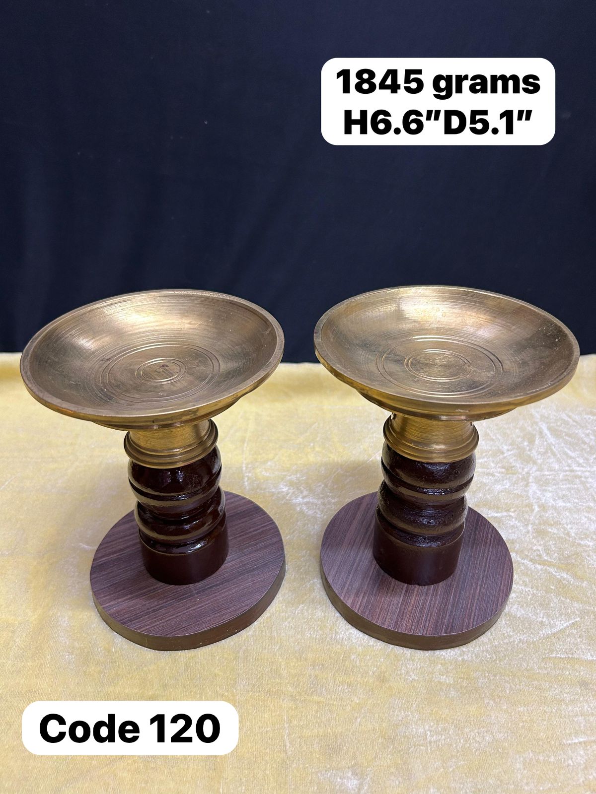 Panchaloha handcrafted bowl lamps on wooden stand-https://s3.ap-south-1.amazonaws.com/prod-media-vyaparify-com/vcards/products/69380/c071dd05-150e-4ec4-89a1-8f79617e8a22.jpg Image