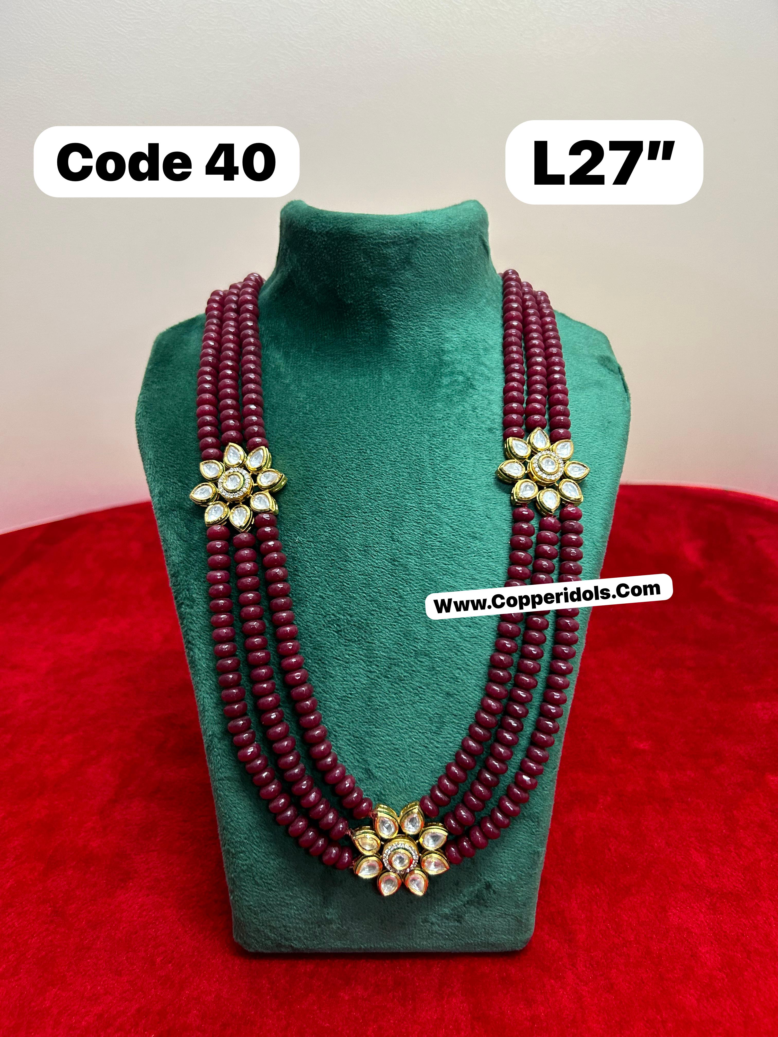 panchaloha made gold polished  semi precious red stones embossed with pearl mala-https://s3.ap-south-1.amazonaws.com/prod-media-vyaparify-com/vcards/products/69763/59d237ec-6f87-4932-90f8-377b42e66113.jpg Image