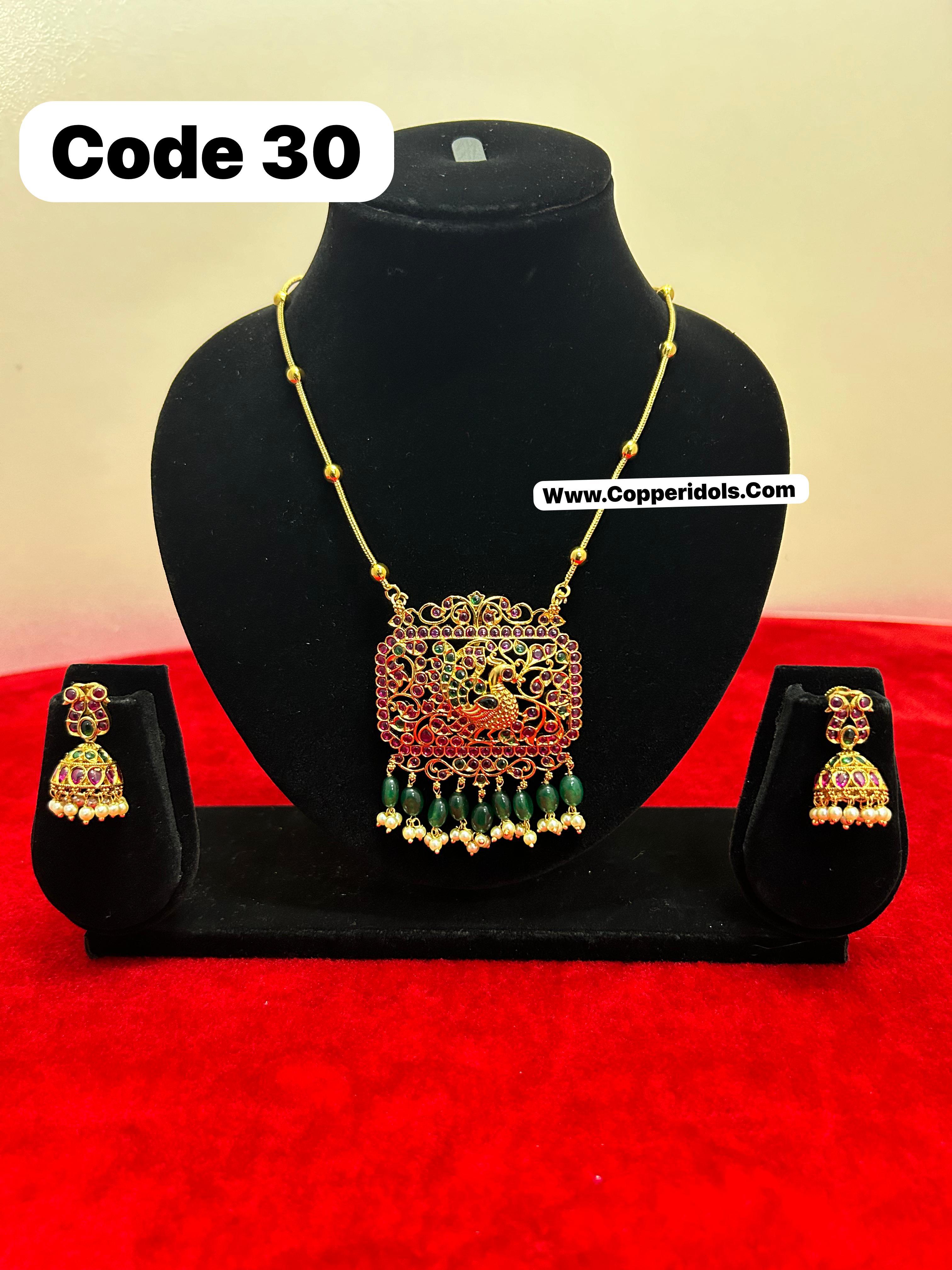 Panchaloha gem studded pendant necklace with earrrings-https://s3.ap-south-1.amazonaws.com/prod-media-vyaparify-com/vcards/products/69895/8851e397-4f2c-4b86-a7c5-fbf103f0ba16.jpg Image