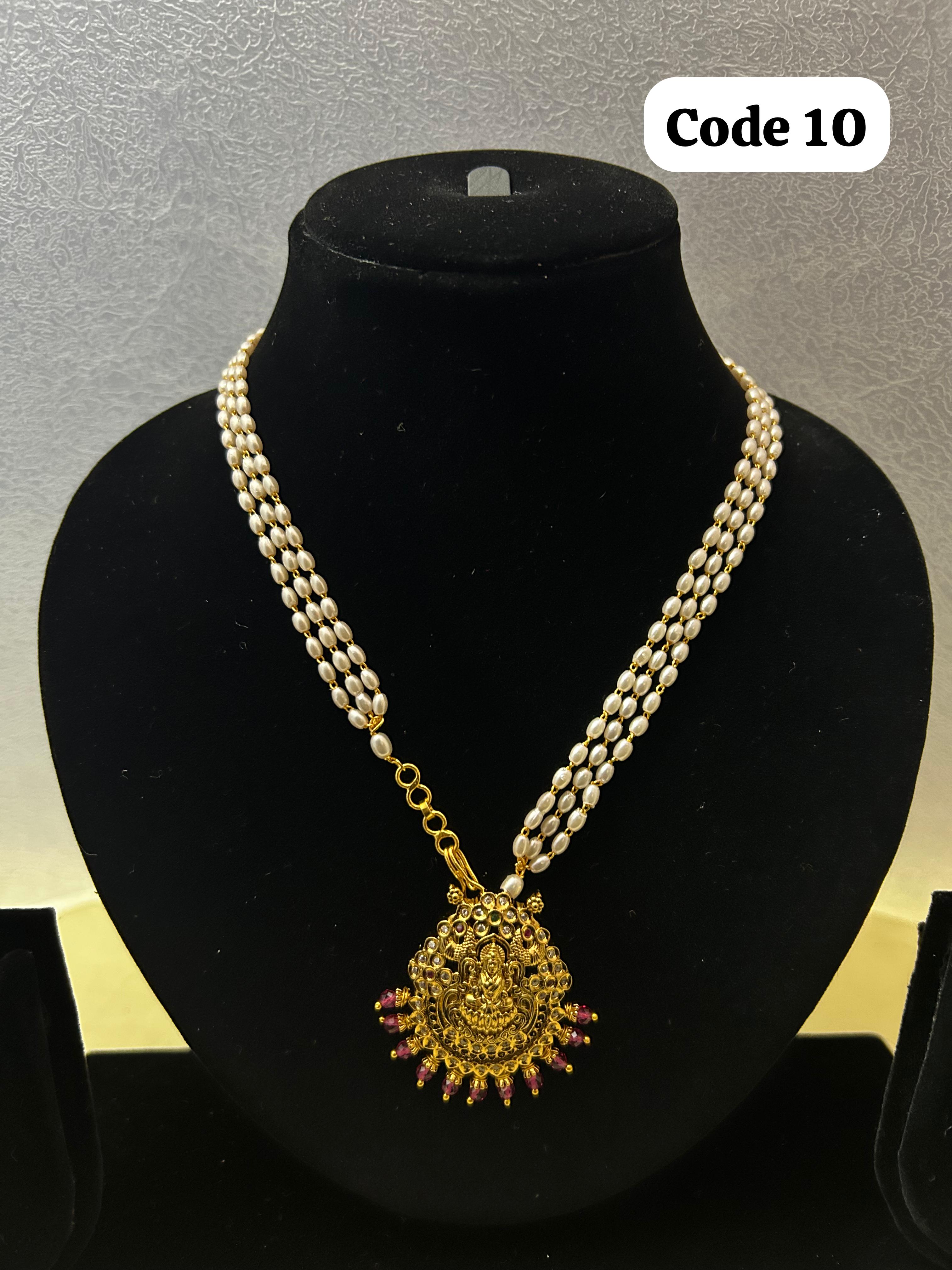 Panchaloha made gold polished Lakshmi pendant with pearl mala-https://s3.ap-south-1.amazonaws.com/prod-media-vyaparify-com/vcards/products/70067/048F2ACB-3BB2-4E1A-B75A-7863B040B3A6-%281%29.JPG Image