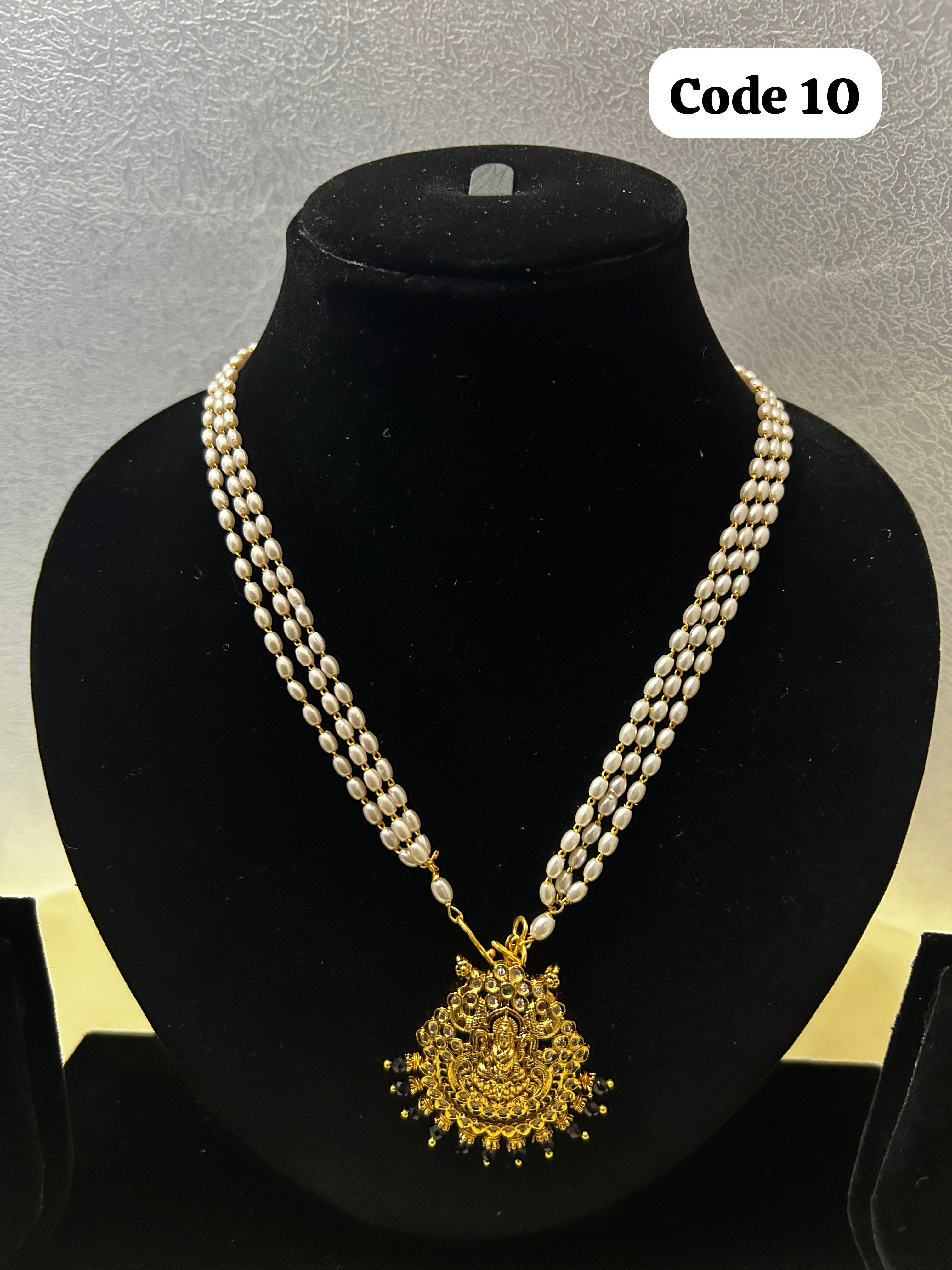 Panchaloha made lakshmi pendant with pearl mala-https://s3.ap-south-1.amazonaws.com/prod-media-vyaparify-com/vcards/products/70068/E257BDF4-9526-4382-9802-F46F636CAB60.JPG Image