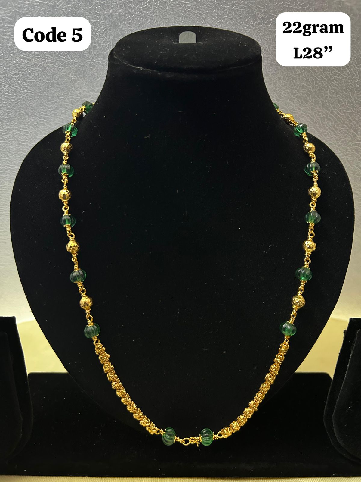 Panchaloha made gold polished gundu mala with green beads-https://s3.ap-south-1.amazonaws.com/prod-media-vyaparify-com/vcards/products/70078/3bb8a102-e7d8-4730-be0d-4e541fade32c.jpg Image