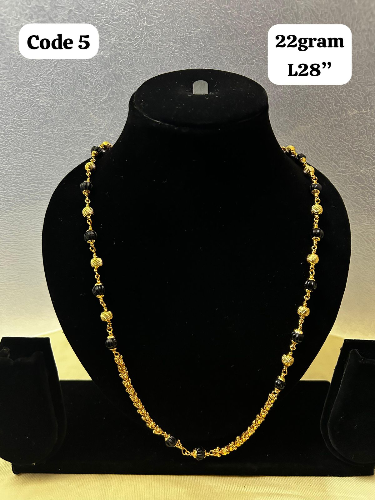 Panchaloha made gold polished gundu mala with black beads-https://s3.ap-south-1.amazonaws.com/prod-media-vyaparify-com/vcards/products/70079/b76b7821-1d74-4ffd-84b7-033006530e1c.jpg Image