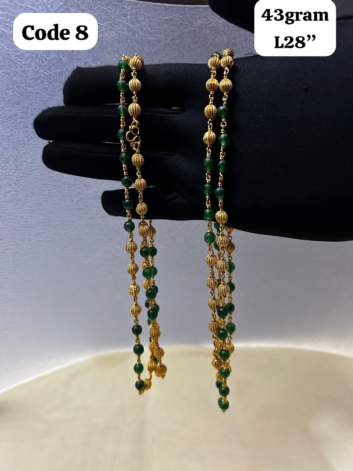 Panchaloha made gold polished gold mala with green beads-https://s3.ap-south-1.amazonaws.com/prod-media-vyaparify-com/vcards/products/70092/0c01b872-69a1-4408-8d86-95d227a2f327.jpg Image