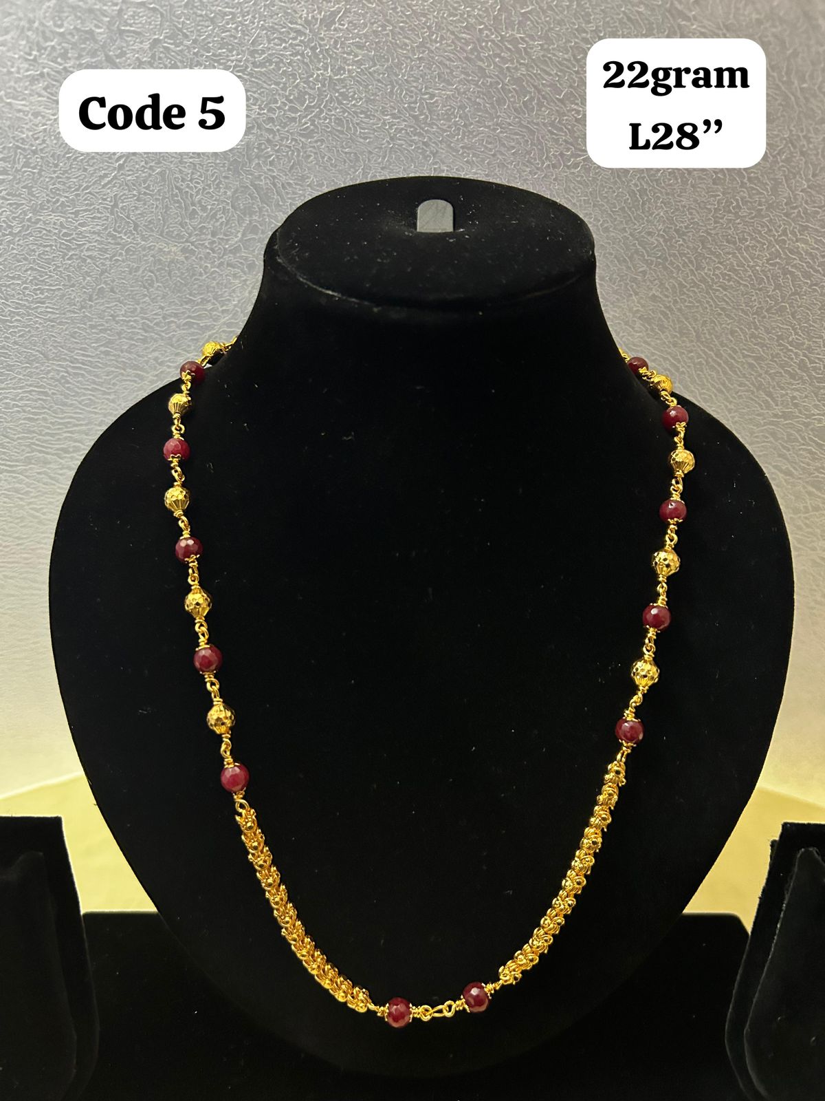 Panchaloha made gold polished mala with red beads-https://s3.ap-south-1.amazonaws.com/prod-media-vyaparify-com/vcards/products/70098/d347f3d8-4e68-4962-b968-1afffce82ecc.jpg Image