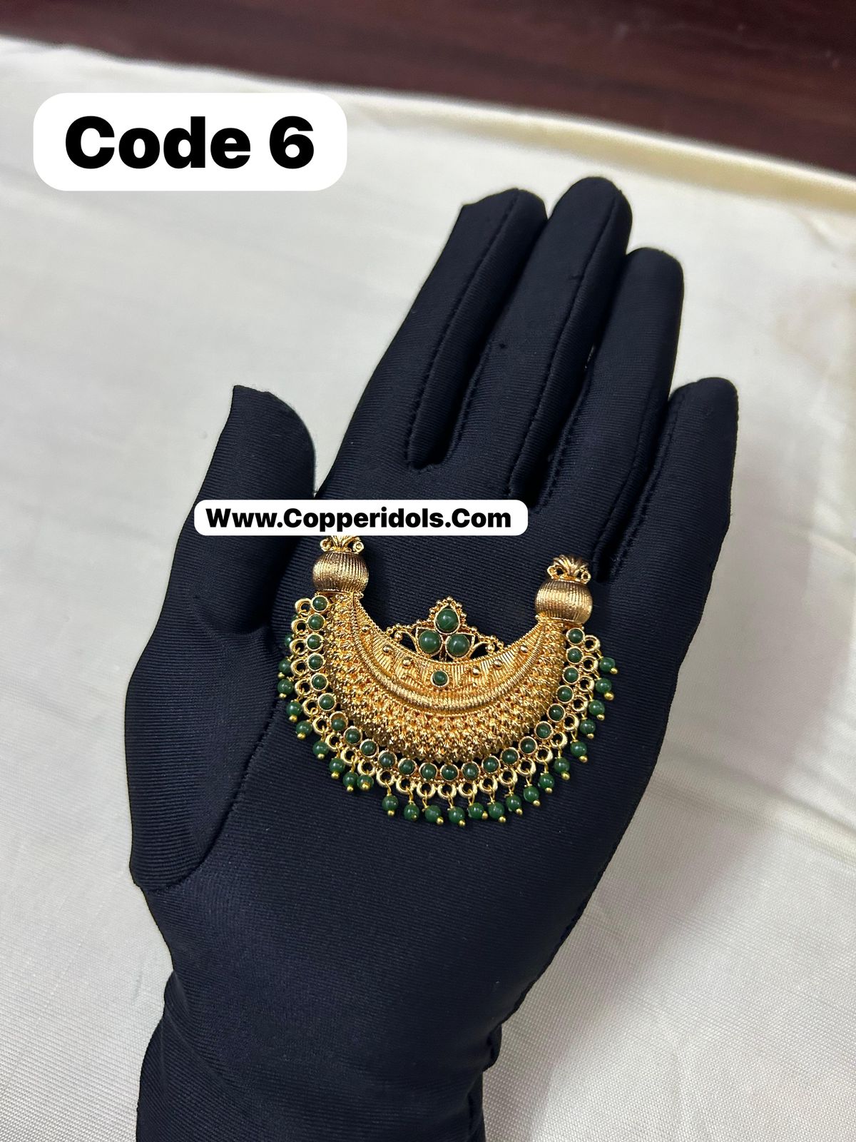 Panchaloha made gold polished green stones pendant-https://s3.ap-south-1.amazonaws.com/prod-media-vyaparify-com/vcards/products/70326/0d13d22c-6826-4a96-b7a0-4cb138bd1033.jpg Image